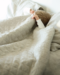 Quilted linen duvet in natural flax colour