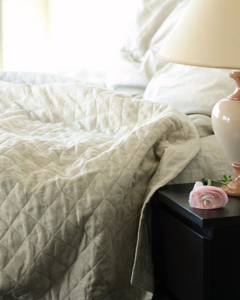 Quilted linen duvet in natural flax colour