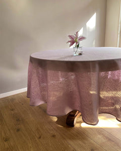 Round tablecloth from soft linen in lilac