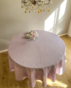 Round tablecloth from soft linen in lilac